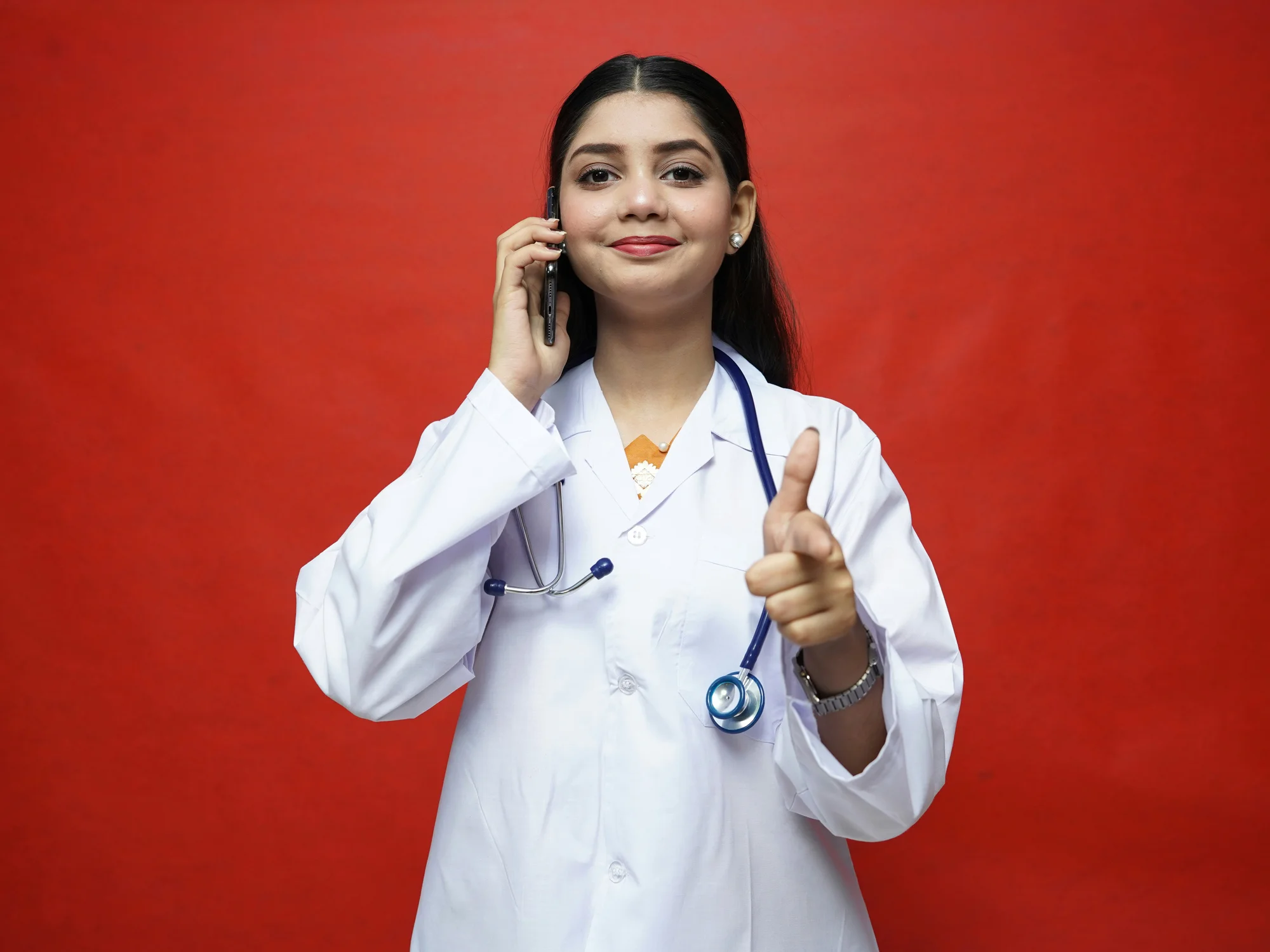 A doctor on the phone with a patient about an upcoming appointment