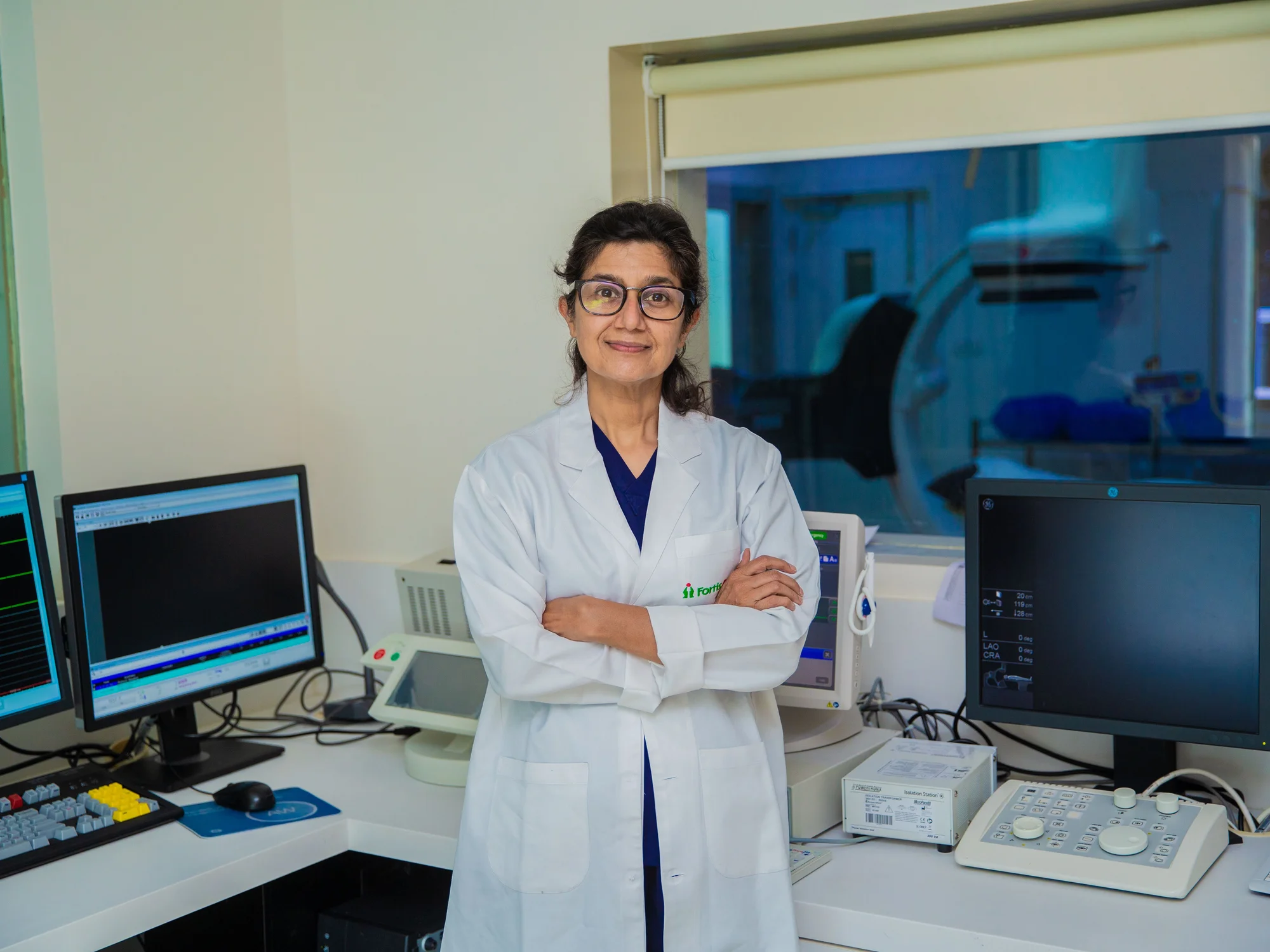A radiology doctor in the scanner control room