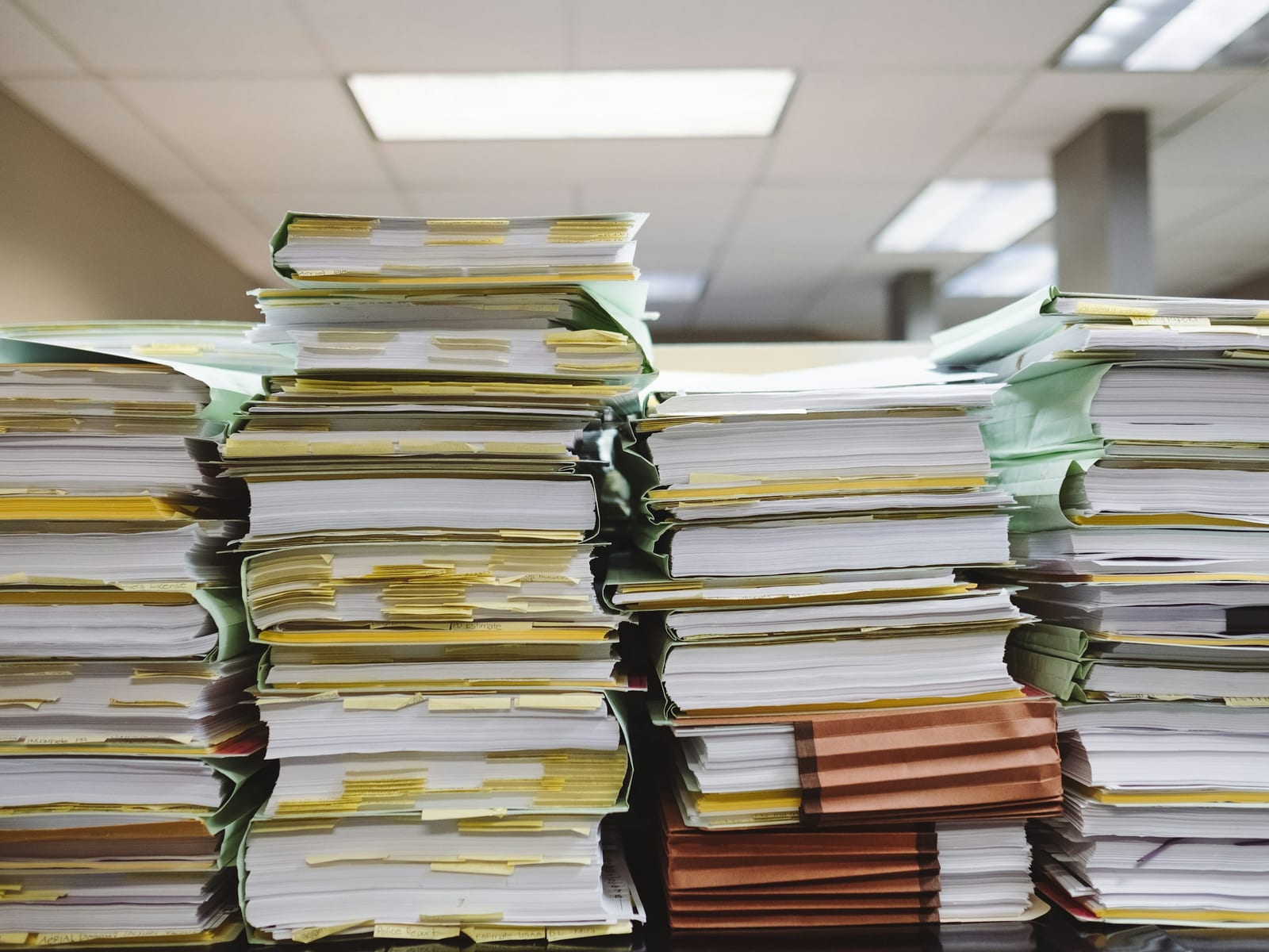 Stacks of patient files in a medical records room