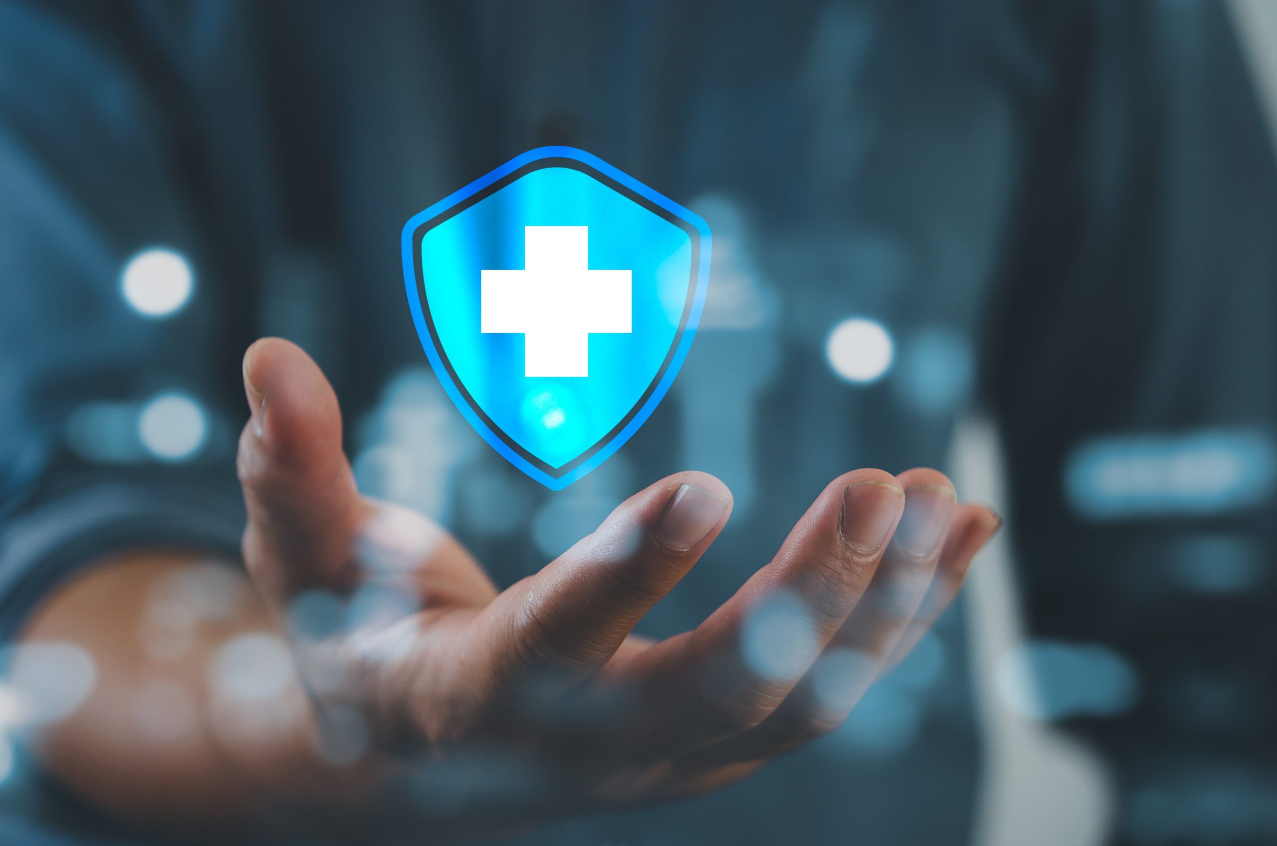 Man hand holding virtual medical health care icons with medical network connection.Business insurance. Man hand holding virtual medical health care icons with medical network connection.Business insurance.