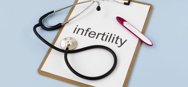 top-view-infertility-word-written-paper top-view-infertility-word-written-paper